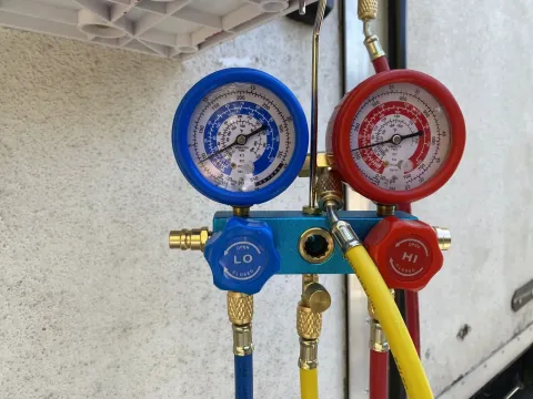 Drawing vacuum and adding refrigerant