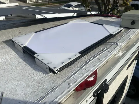Ended up scraping it once Gen3 came out.  The field-of-view upgrade really improved flat-mount use. It's already-flatness also let me quickly whip up a 2020 extrusion and laser-cut Delrin mount. I was at least able to reuse the aluminum roof-mount brackets.
