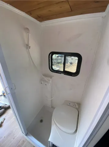 Hot-water shower and flushing toilet